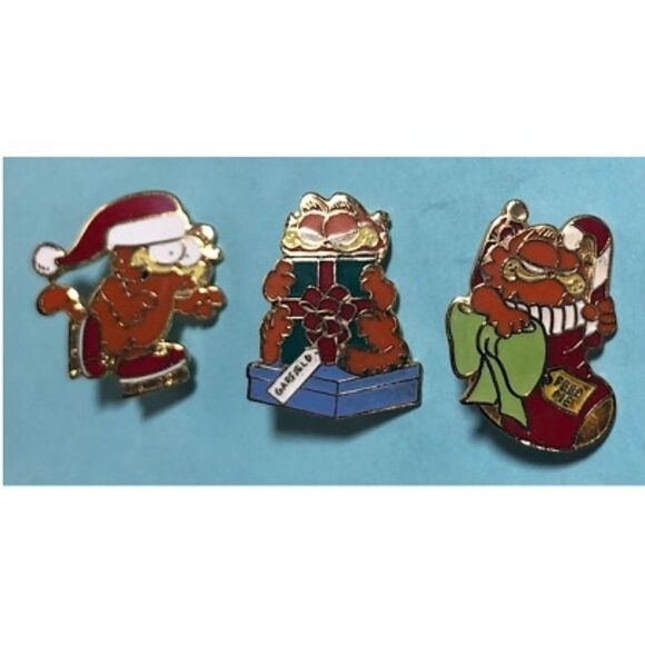 3-1978-Jim DAVIS,GARFIELD CHRISTMAS Collector's Lapel Pins UFS Skate Present - Picture 1 of 8